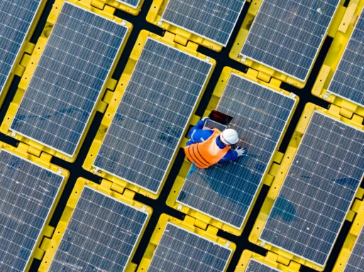 Floating solar panels providing renewable energy. Aerial view floating on solar cells and